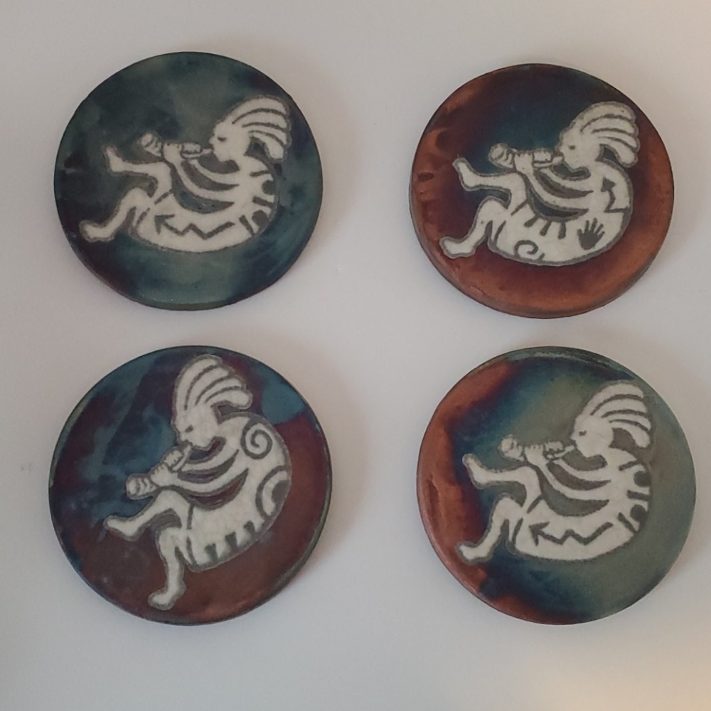 Earth and fire kokopeli coasters